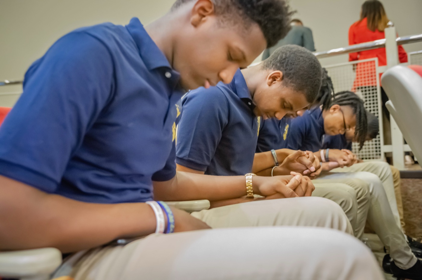 Students in quiet reflection before presenting