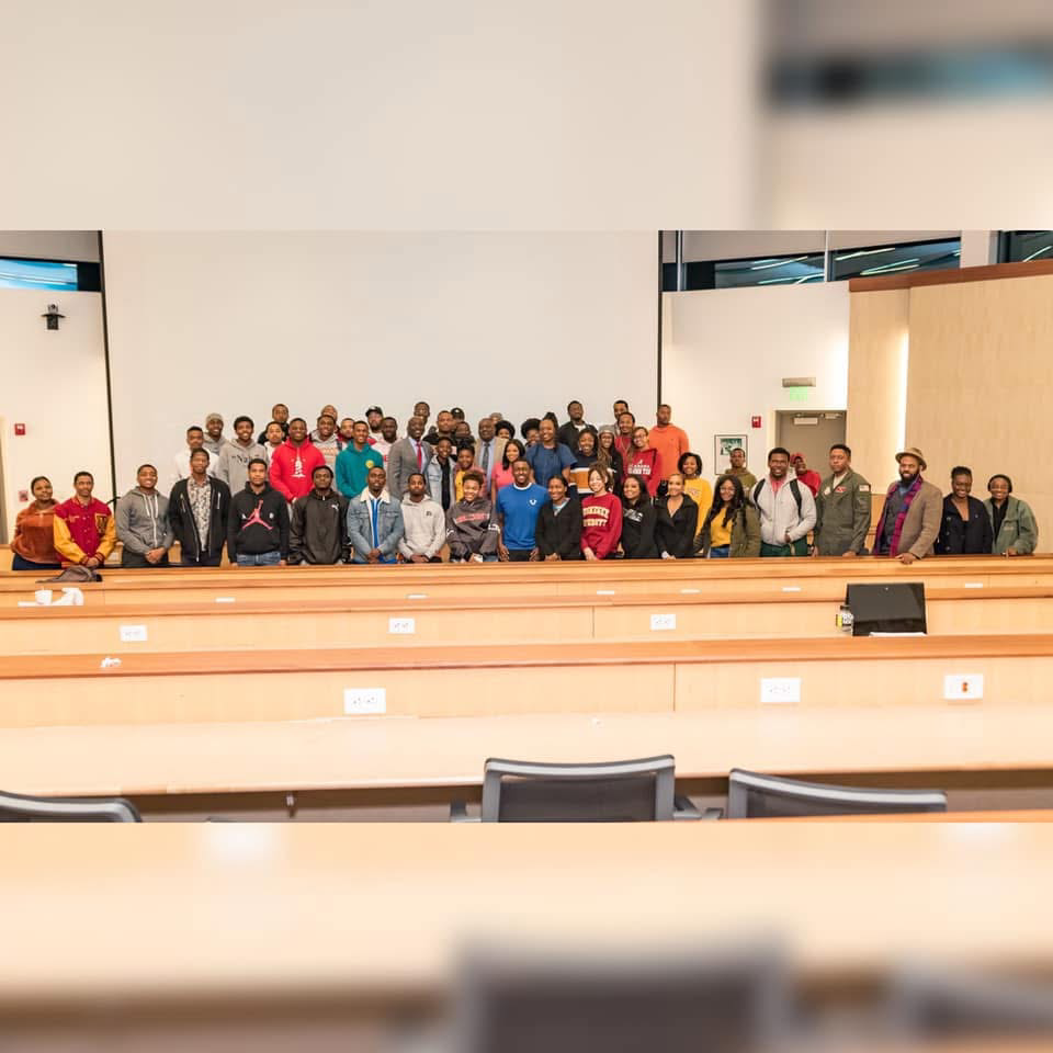 Patrick Davis with students and community members after a campus session